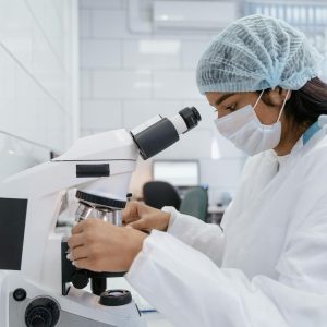 Scientist Working with Microscope
